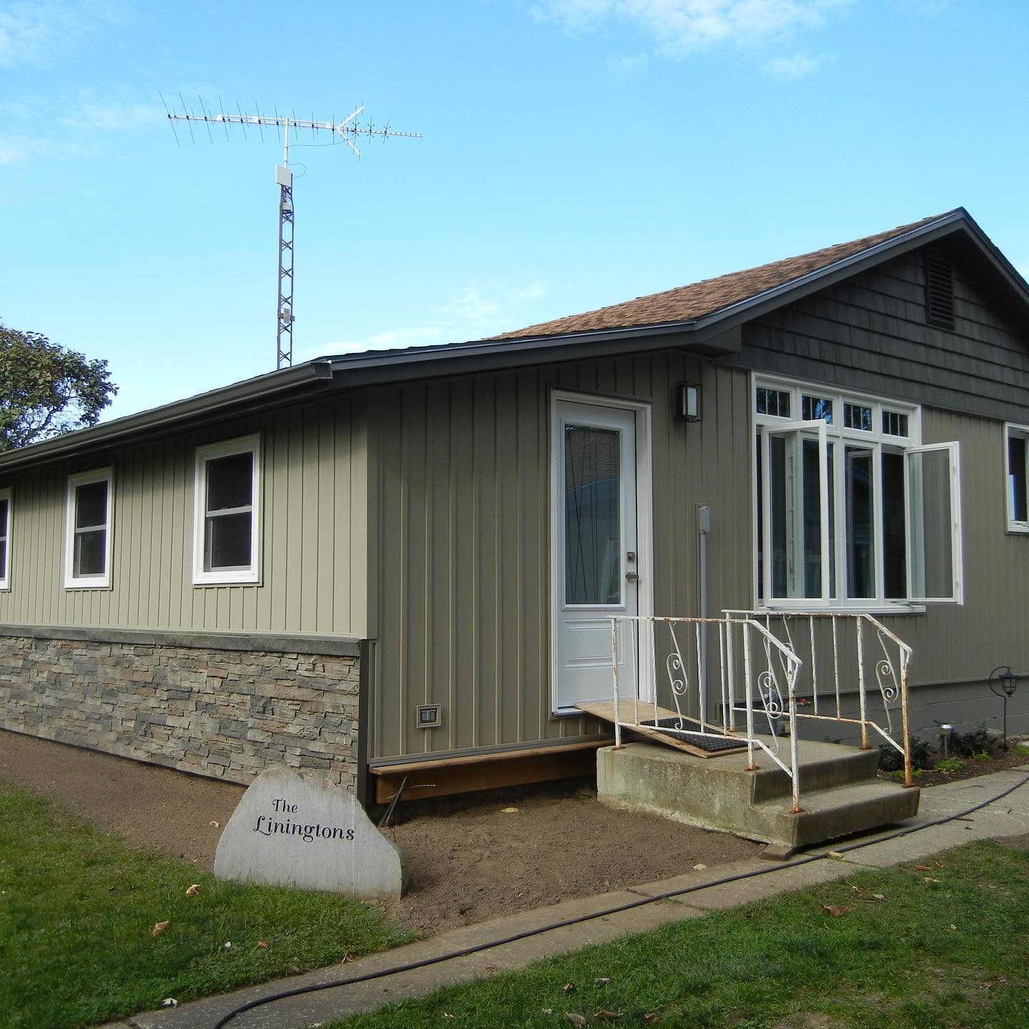 The Haines Group renovation exterior siding windows doors front